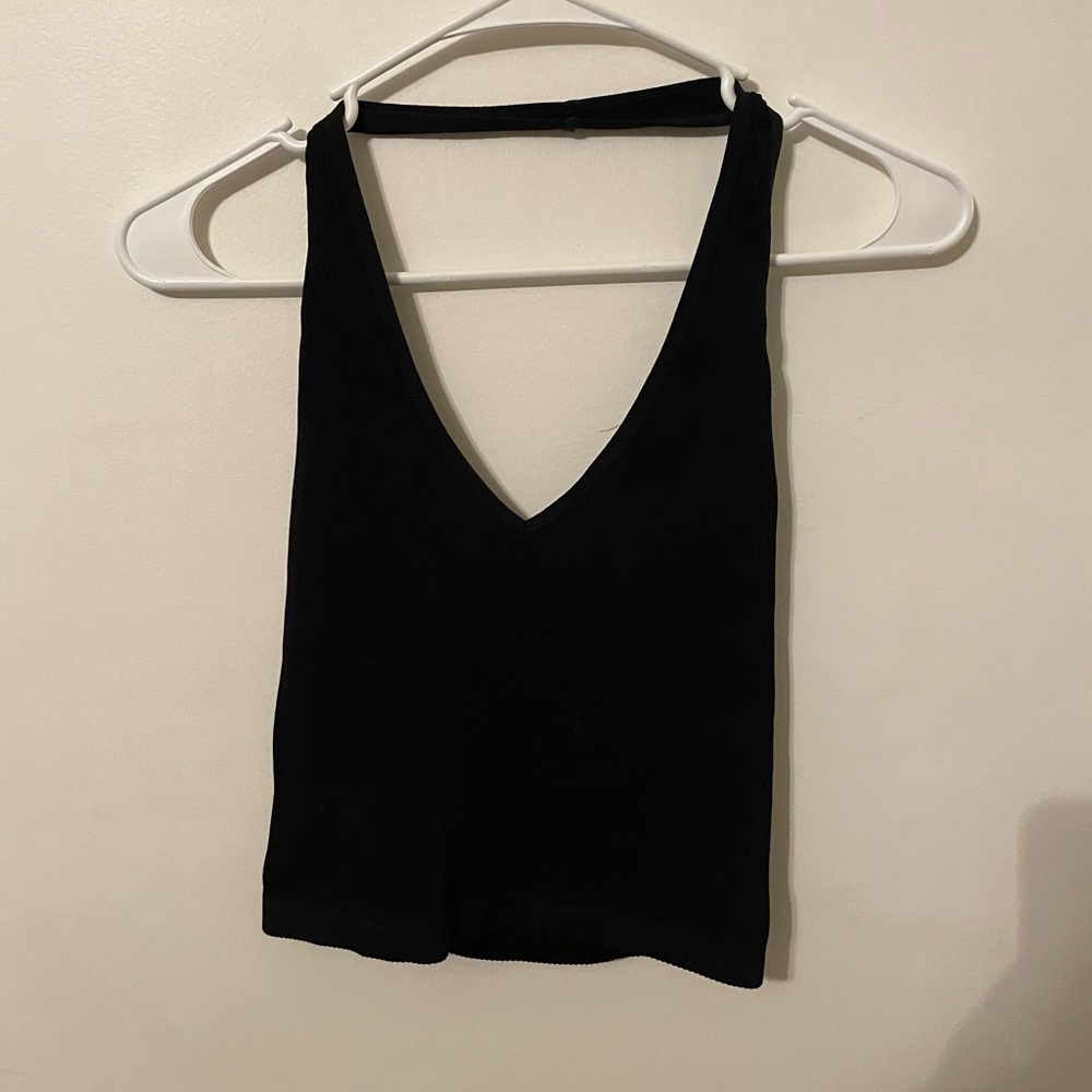 Black halter out from under top